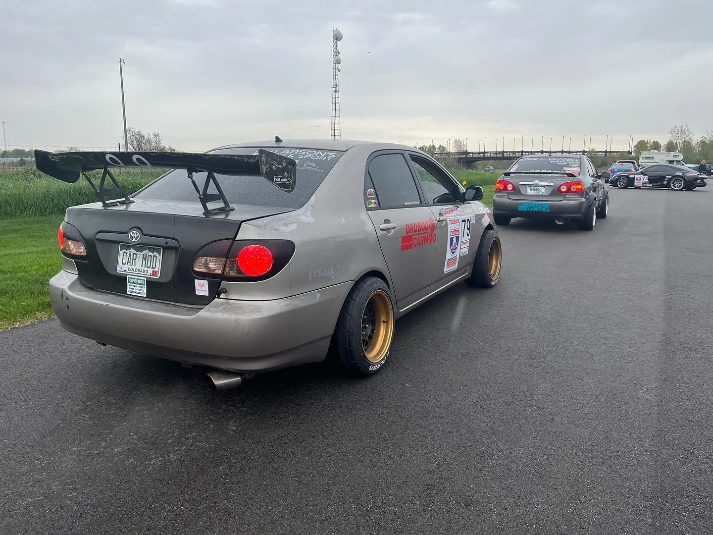 Gold'rolla, the gold Dadbod Carmod Toyota Corolla.