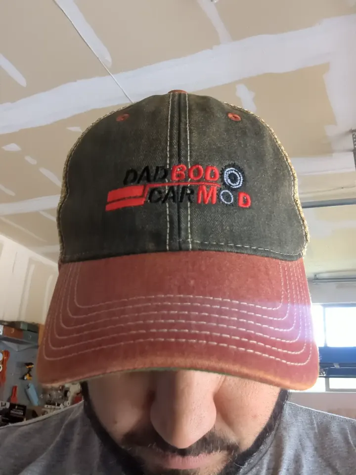 Dadbod Carmod embroidered cap shown in the garage