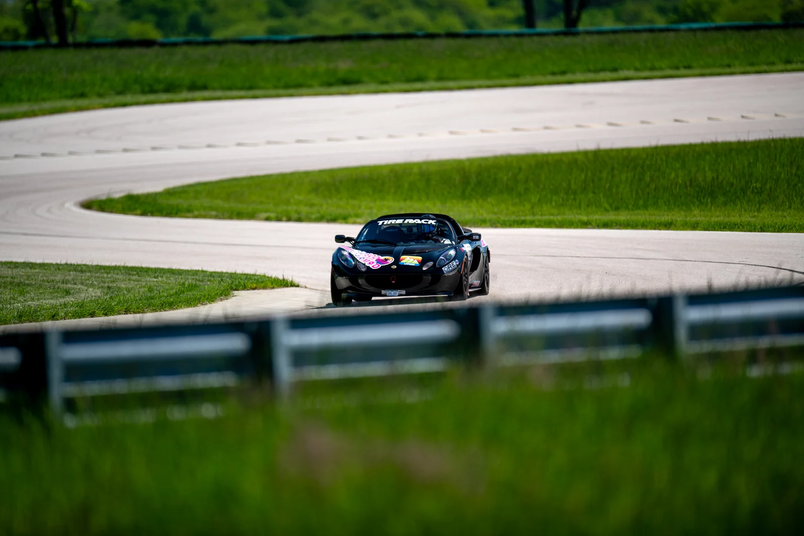 Kevin Post driving black Dadbod Carmod Lotus Elise number 58