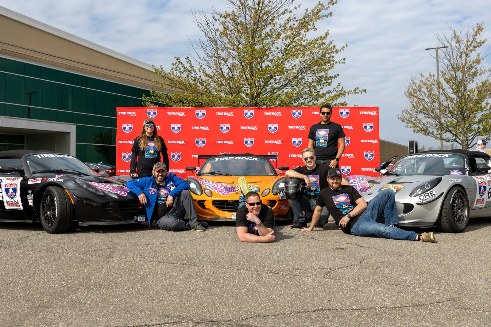 Dadbod Carmod team members with the Lotus Elise program at One Lap of America 2025