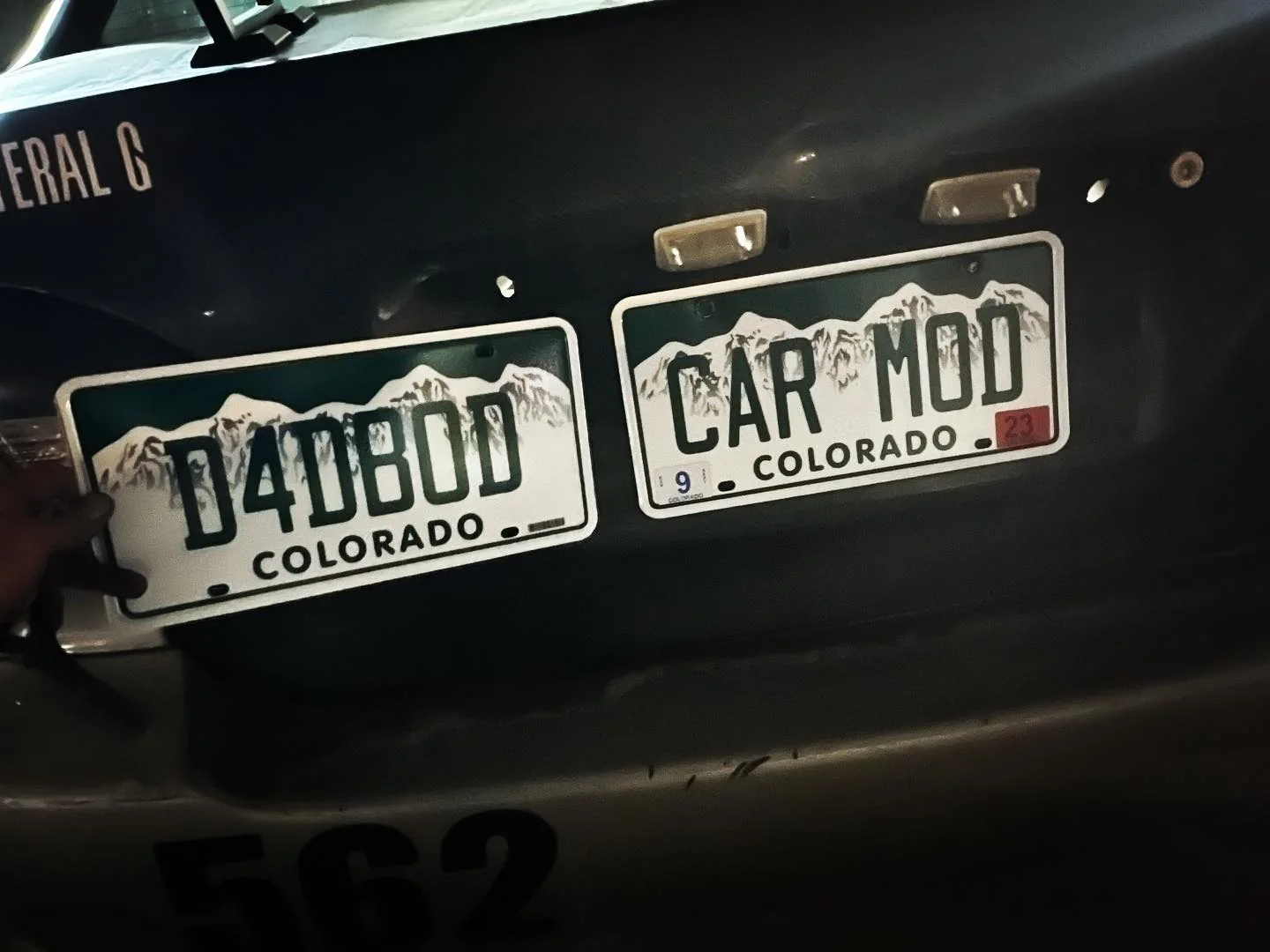 Colorado specialty plates reading D4DBOD and CAR MOD displayed together