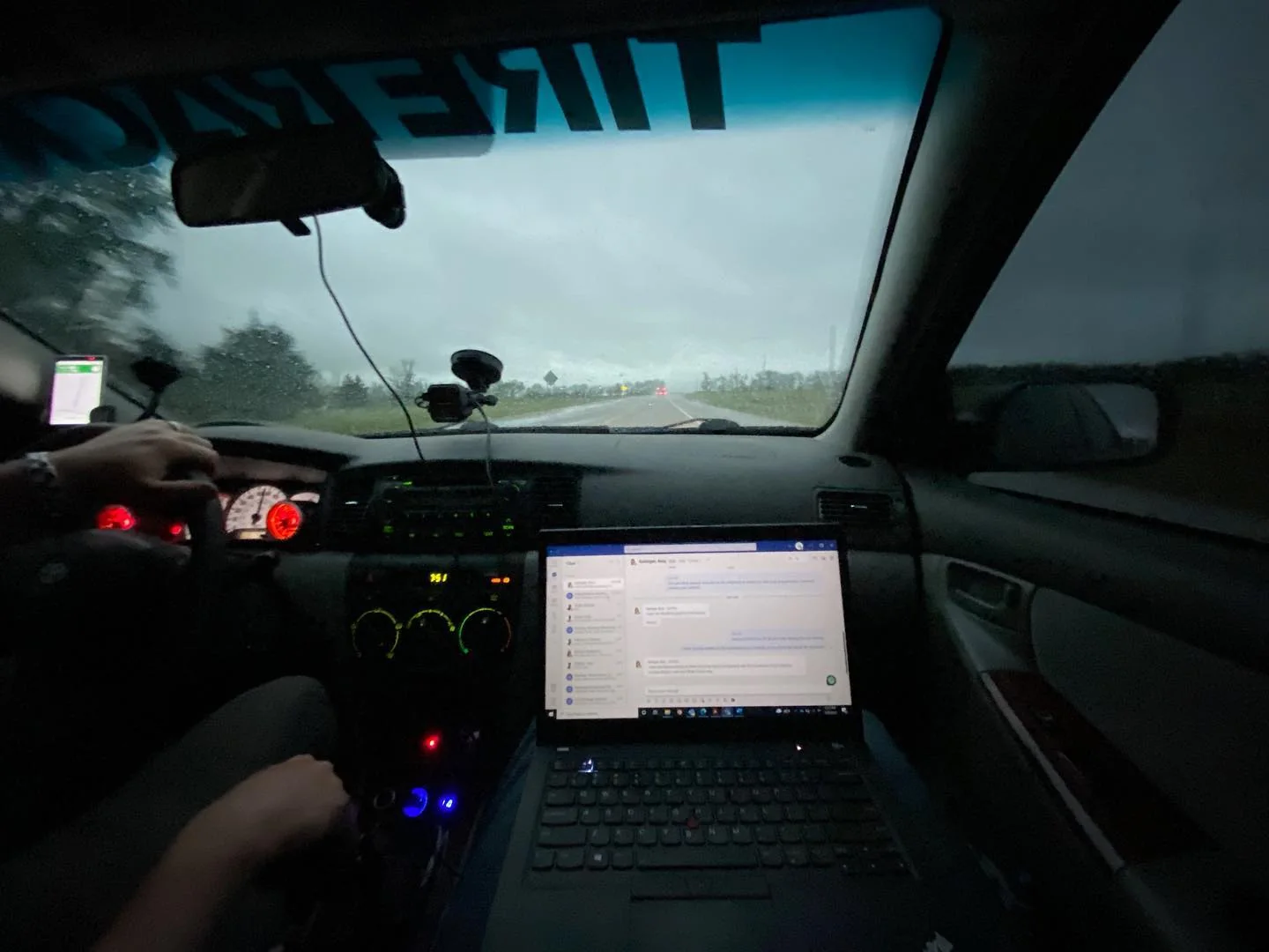 Interior view of a Corolla with a laptop used during a driving session