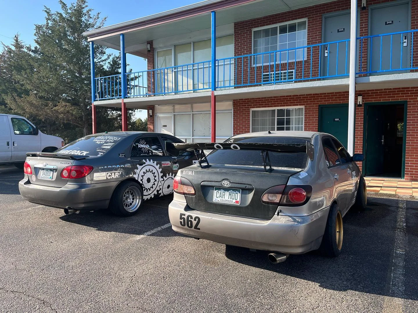 Two gray Dadbod Carmod Corollas parked together during a road stop