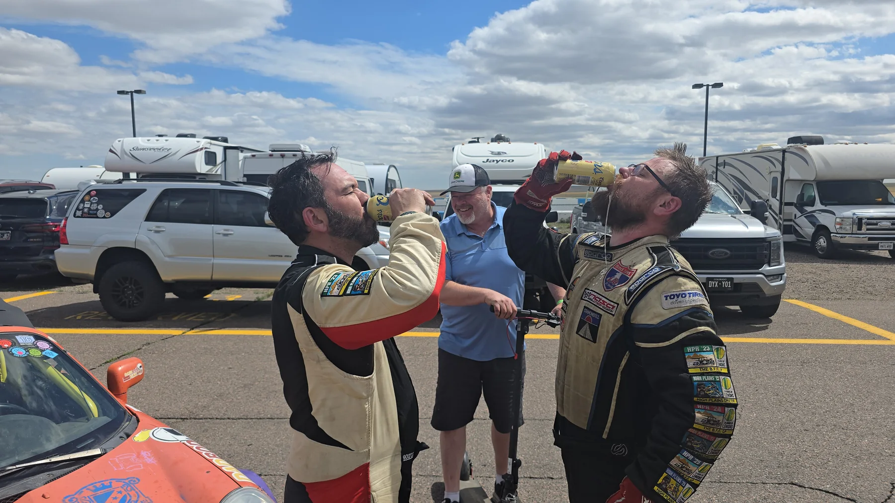 Dadbod Carmod team members celebrating together trackside