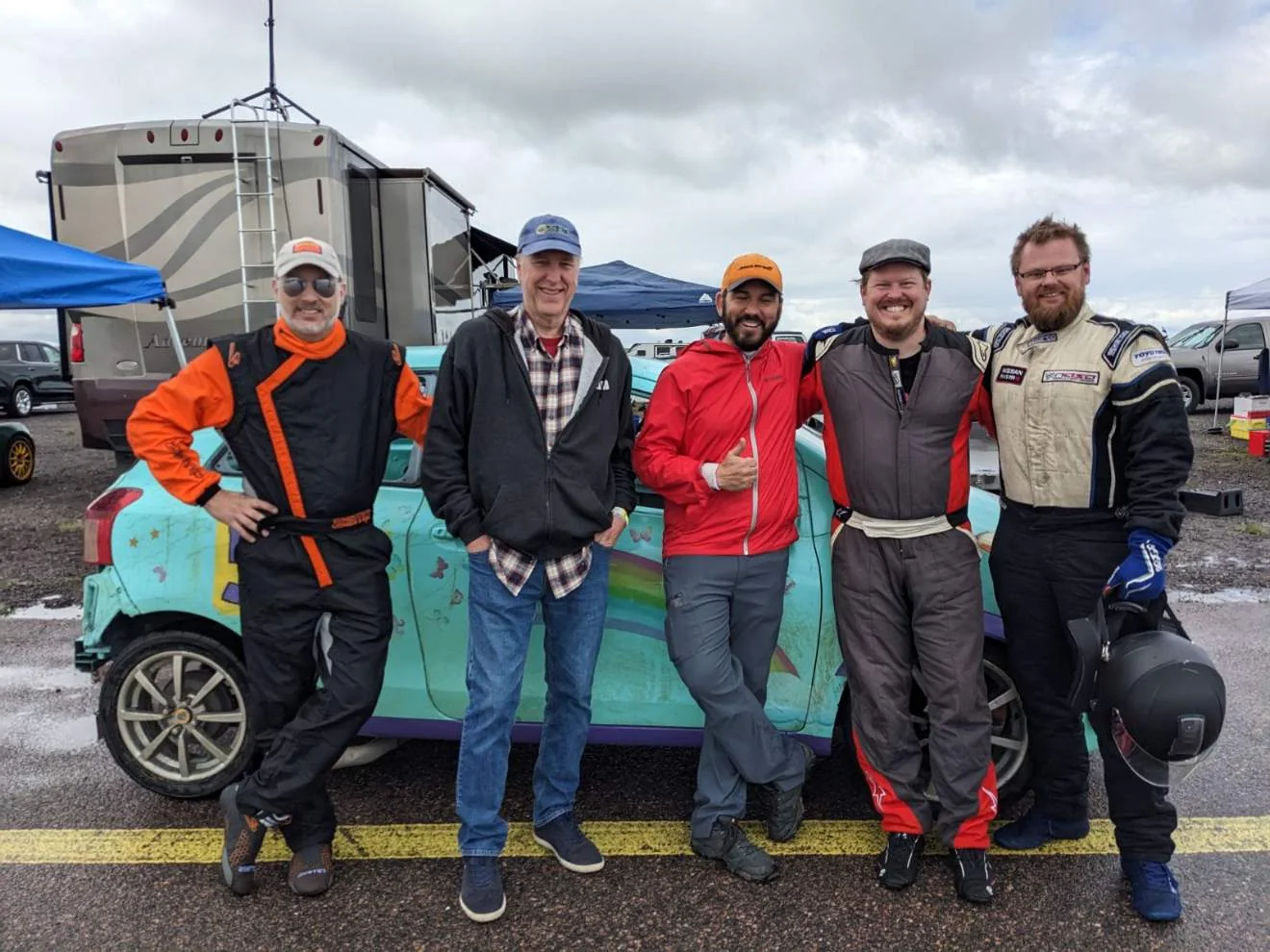 Dadbod Carmod team members standing together with the Yaris